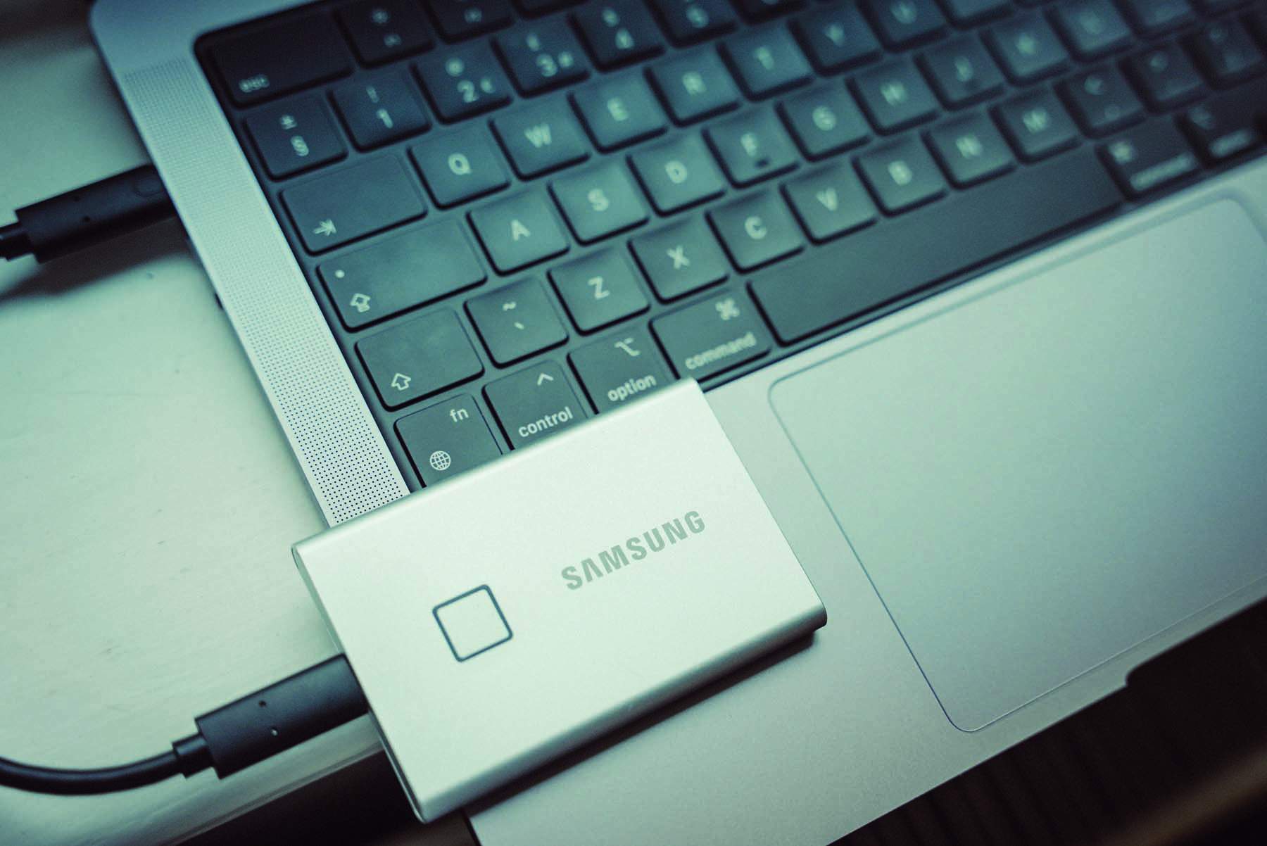 Samsung Portable SSD T7 Touch on laptop keyboard