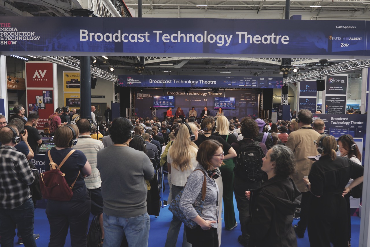 The entrance to a busy conference with a blue archway that says 'Broadcast Technology Theatre'