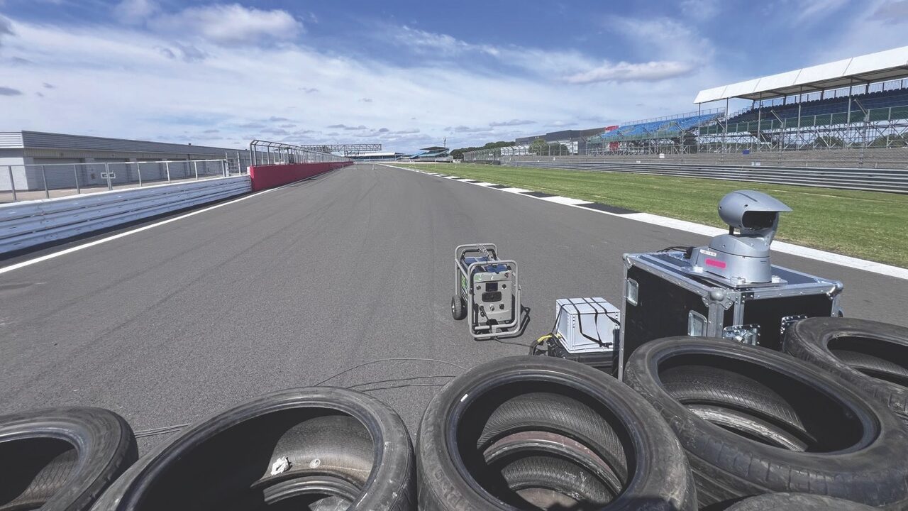 A car race track with tires in the foreground
