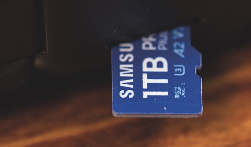 A small micro SD card poking out of a black device