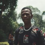 A man standing outside with a look of concern