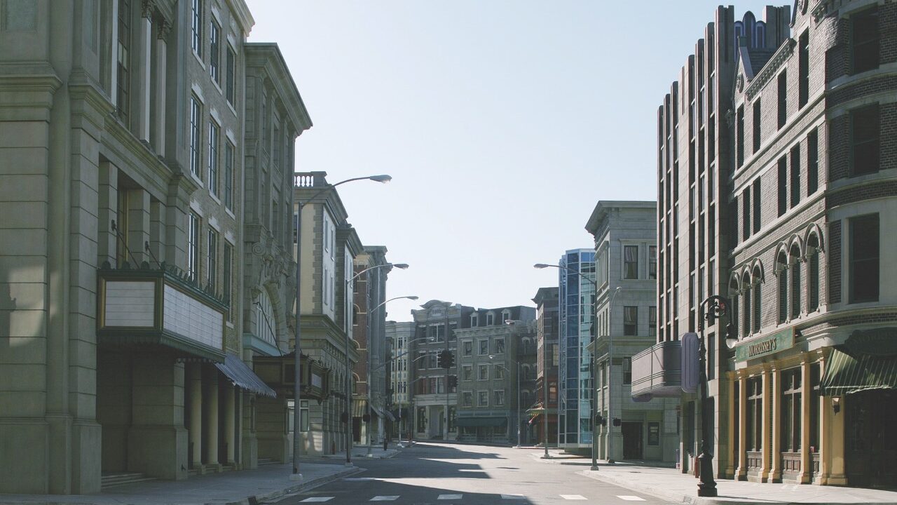 An empty street in a city with buildings either side