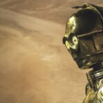 A golden robot standing in a desert