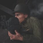A realistic animation of a soldier wearing a helmet and holding a camera laying on the ground, against a black background