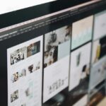 Close up of a monitor showing columns of pictures in photoshop
