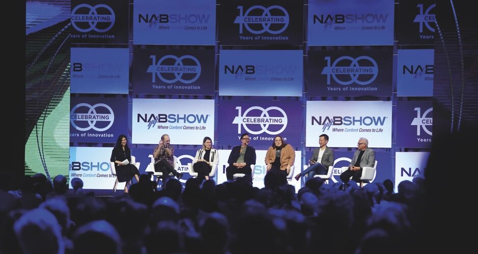 NAB conference with a panel sitting at the front of a crowd