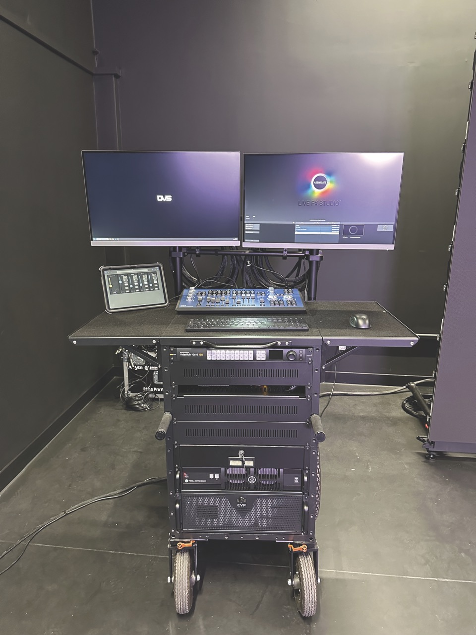 Two monitors and kit on a moveable trolley