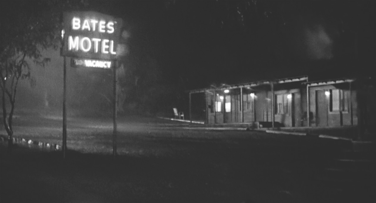 A black and white photo of the exterior a Bates Motel