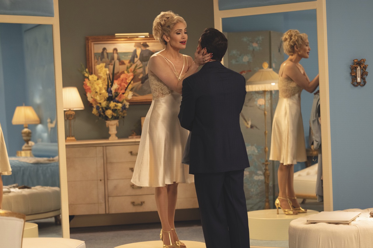 Two handheld cameras on Easyrigs were used to capture scenes in the prison cell A still from Kiss of the Spider Woman showing a woman holding the face of a woman in a dress room