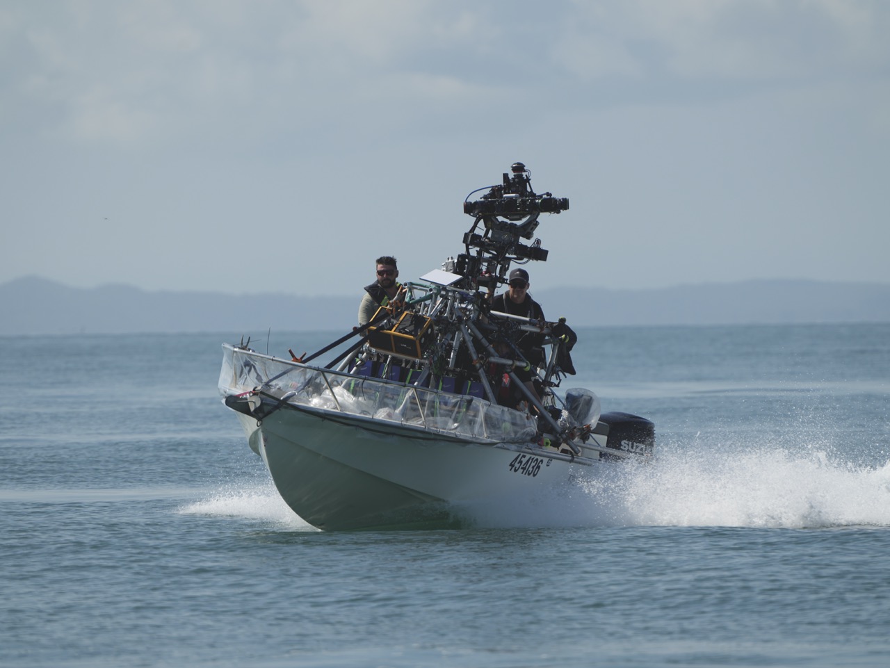 A boat with a large camera on the front