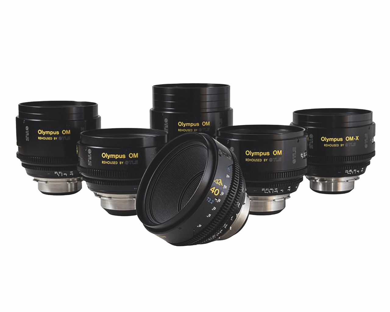 A collection of lenses from Olympus OM, against a white background
