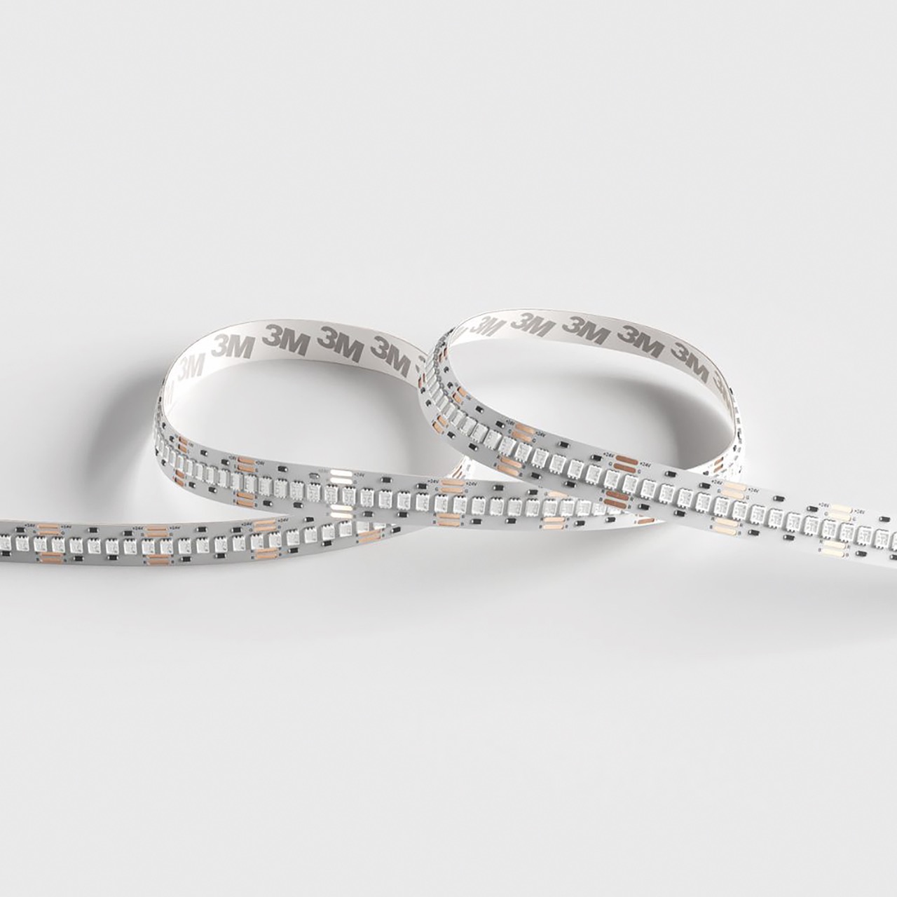 A reel of film with two loops in it, against a white table