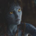 A blue Avatar looking up in concern